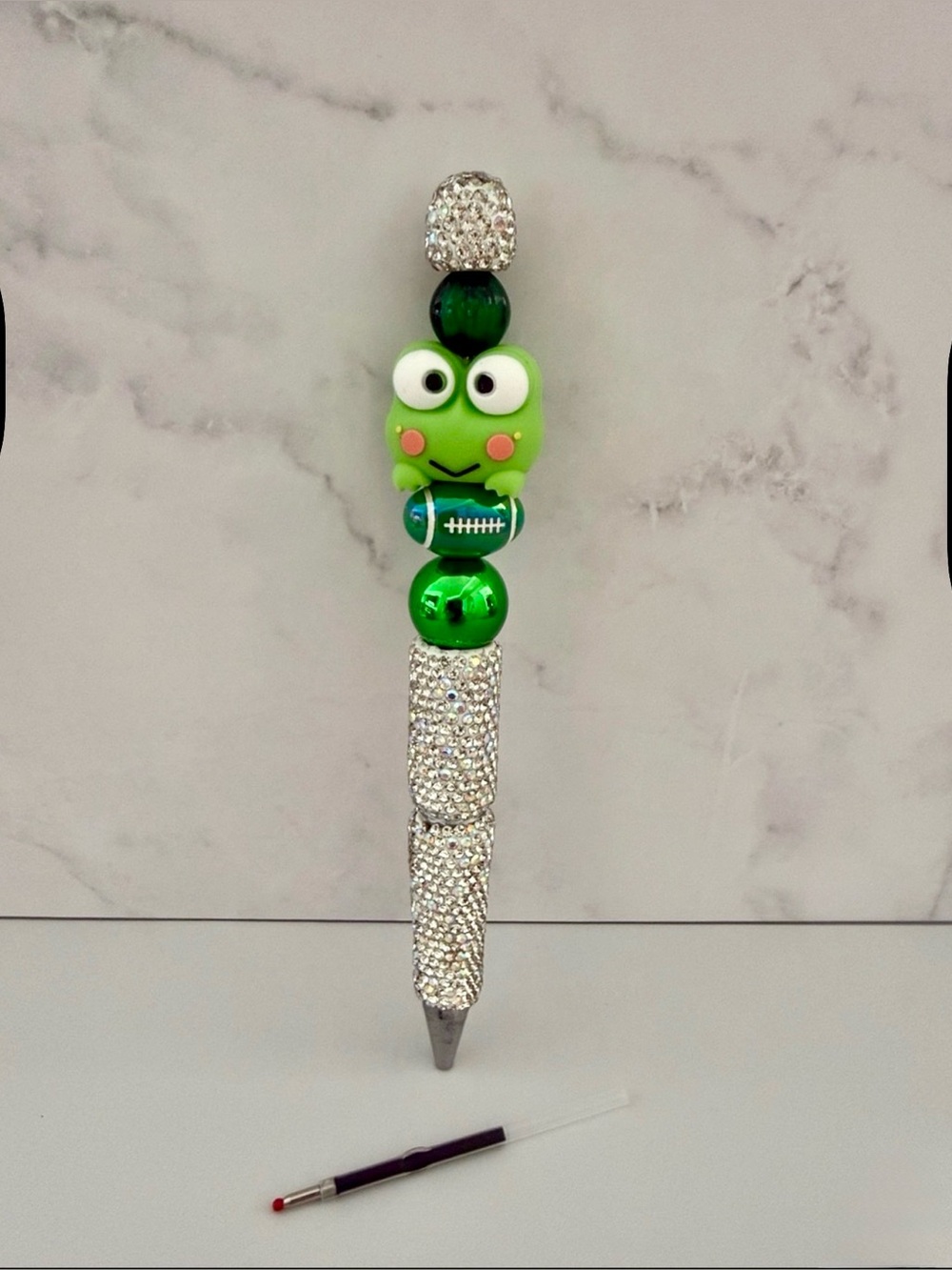 🏈 🐸 Adorable Keroppi Football and Beaded rhinestone Pen: Black ink refill.